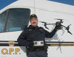 Identification Constable Marc Sharpe of the Kenora Identification Services Unit, Ontario Provincial Police with Draganflyer X6.