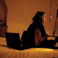 Hometaping girl recording her own music at home.