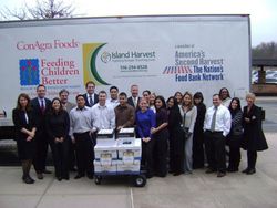 Lawyers and staff of Schwartzapfel Truhowsky Marcus P.C.  in front of Island Harvest food truck