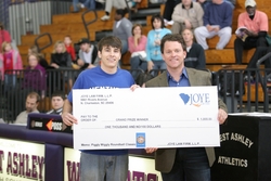 Attorney Mark Joye presents Kevin Fletcher with his $1,000 grand prize