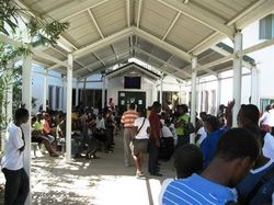 People Gather Outside to Wait in Line for the Clinic