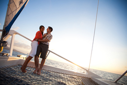 Couple on the Island Routes Caribbean Adventure Tours Lover's Rock Sunset Sail luxury catamaran tour, www.islandroutes.com.