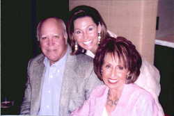 Mrs. Jean Schwarz (right) with her husband and daughter