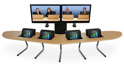 Boomerang Studio&#8482; Video Conference Table for video teleconferencing. Laptops or wide screen LCDs present data in users' personal space.