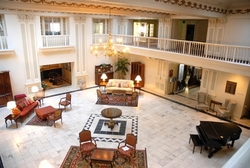 The elegant lobby of the Roberts Hotel includes nine skylights and ornate plasterwork.