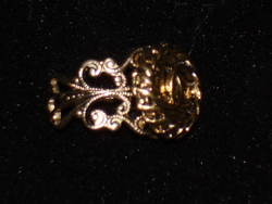 Vintage Chanel button re-purposed on a gold filigree ring band. Find Chanel button rings, choker necklaces and cuff bracelets at http://etsy.com/shop/lynnjulian