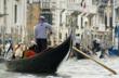 Couple taking a gondola ride in Venice
