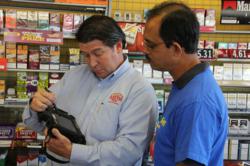 Ben E. Keith sales rep uses MobileDemand Rugged Tablet PC for beer sales at retail store.