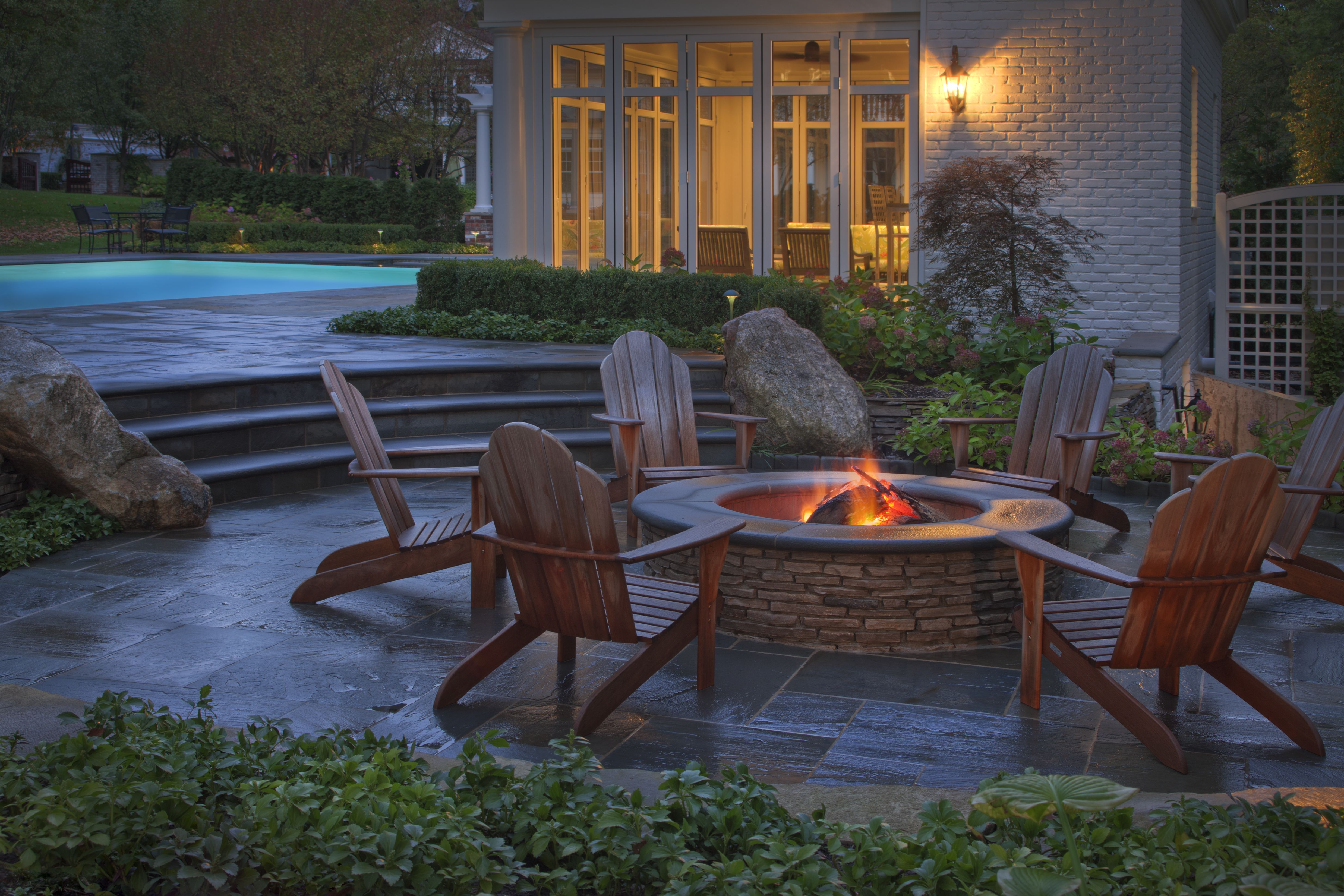 Backyard fire features create a warm, inviting backyard landscape ...