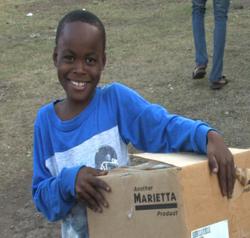 Haitian Child Holding Marietta Soap Donation