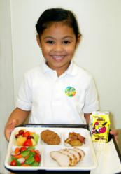 Student with La Prima school lunch