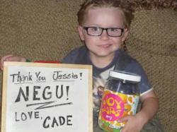 Young cancer patient with his Joy Jar from The NEGU Foundation