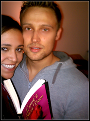 Newly weds, Jordan Tant and Emily James with personalized proposal novel, Love’s Next Door