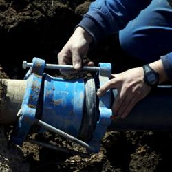 Technician fixing water pipeline