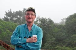 Tom Lovejoy in the Brazilian rainforest; photo by Craig Kasnoff