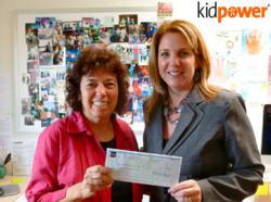 Irene van der Zande, Kidpower Founder and Executive Director, receives a grant check from Wells Fargo AVP/Manager Michele Bassi.