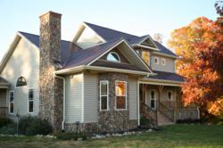 Older home with brick exterior and nicely landscaped yard