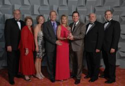 Photo of All Inclusive Outlet President Accepting Award