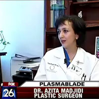 Dr. Azita Madjidi speaking to a FOX News Reporter while sitting at her desk.