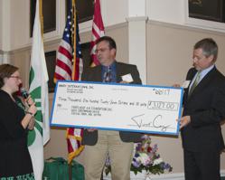 Jim Cupp presenting the check Handy gave to the MD 4-H Foundation