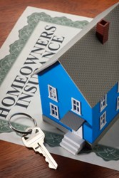 Homeowners Insurance form, toy house and key