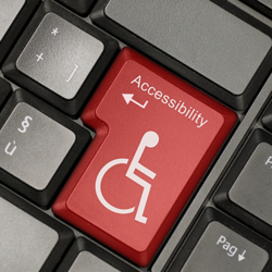 Keyboard with the return key replaced by a disability graphic.