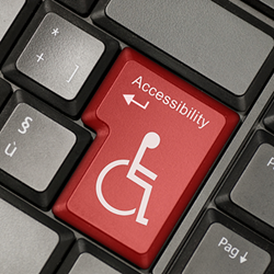 Keyboard with the return key replaced by a disability graphic.