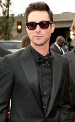 Adam Levine impresses in an all-black look by designer Tom Ford.