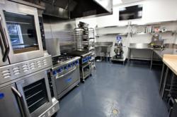 Kitchen FIVE is ideal for baking, with brand new cook lines, reach-in refrigerator, maple top table, shelves for day use and separate prep sinks. This kitchen is also outfitted to accommodate demonstration cooking classes, filming, or small team-building