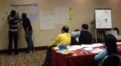 Students engaged in a case study exercise in a Scrum Master Certified class.