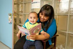 A mother and child read together