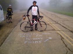 Cyclist Barry Haarde at halfway point of cross country tour near Topeka, Kansas
