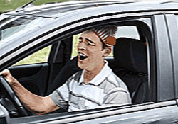 man in night cap driving