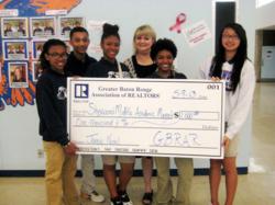 The Greater Baton Rouge Association of Realtors® presented the Teachers' Award of Excellence Grant to Jamie Noel, an assistant principal and teacher at Sherwood Middle Academic Magnet School.