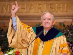 Iowa Senator Tom Harkin gave the sign language symbol for “I love you” after his commencement address at Maharishi University of Management.