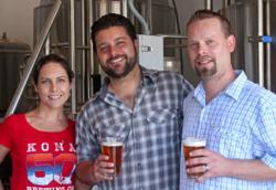 From left, Lindsay and Casey Hawkins, owners of Southgate Brewing Company along with brewmaster Rick Boucke, toast the success of their newly-launched microbrewery with one of their own creations.