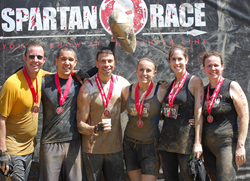 Overall the Spartan Race was tough and muddy. Here part of the New City Chiropractic team gets to the finish line.
