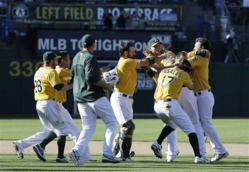 The A's celebrating their victory against the Yankees