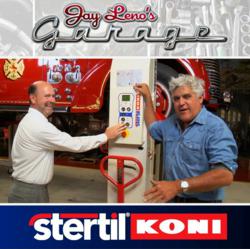 Jay Leno with Carl Boyer, Stertil-Koni sales manager, operating Stertil-Koni Wireless Mobile Column Lifts