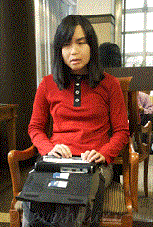 Nina P., WeCo Lead Certified Test Consultant, who is a blind individual, using her assistive device to access the Internet.