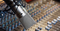 Voice actors at The Voice Realm use professional recording equipment