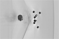 Background-subtracted streak image of 00 buckshot, 354 m/s, detail view. Approved for public release: distribution is unlimited. Image courtesy MetroLaser.
