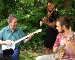 From left: Mike King playing The Shackleton prototype, Hayley Moyses on fiddle, and Solomon Amos playing the Islander Ash Leaf