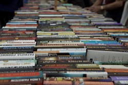 Books lined up on table for Book Bazaar