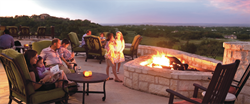 A family spends time together overlooking the Hill Country views of Cordillera Ranch.