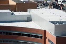 Garland's Clear-Shield Rx coating reduces the rate at which a roof surface will discolour or deteriorate by resisting bacterial and fungal growth