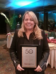 Kelly Friend receiving Around 50 Award