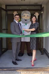 Greg Andon, Libby Haven, and the Gum Guru at the Brass Mill Operations Center for the ribbon cutting ceremony.