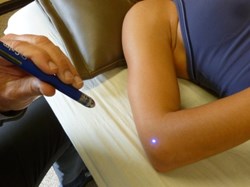 Boise Acupuncturist Tony Burris Treats Megan DeBoi of MD Fitness Using Laser Acupuncture