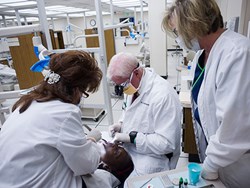 Dr. James Sanderson provides no cost dental work to a patient